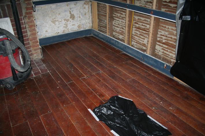 A portion of the floor in the front parlor of the Daniel Lady Farmhouse in normal light.